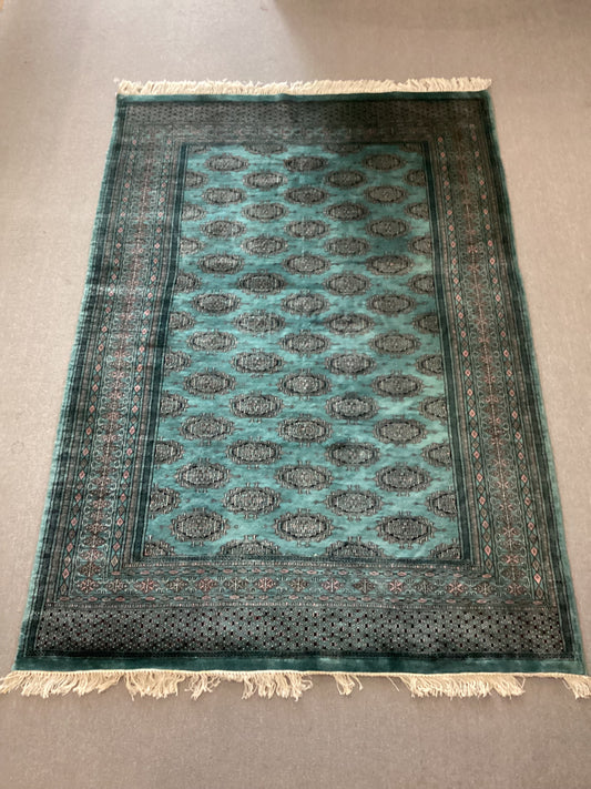 5’1 X 7’10 Green Bokahara Rug